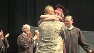 Military dad surprises daughter at graduation