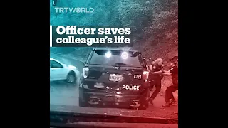 Police officer pulls colleague from the path of an out-of-control car