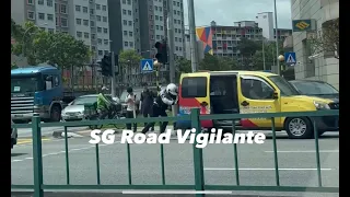 14feb2024 singapore traffic police officer pushing van away from the junction to prevent congestion