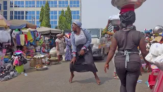 LOCAL MARKET WOMEN DANCING ON STREET, GHANA ACCRA