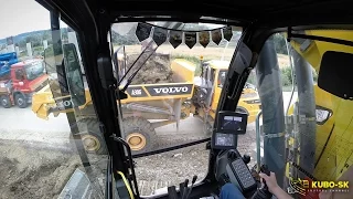 Liebherr R926 excavator with tiltrotator loading Volvo dumper - cab view