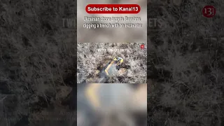 Ukrainian drone targets Russians digging a trench with an excavator