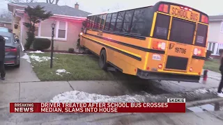 Driver treated after school bus crosses median, slams into Skokie house