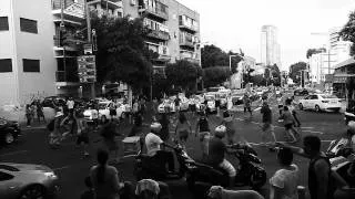 Social justice protesters block Tel Aviv junction in a Hora dance flashmob