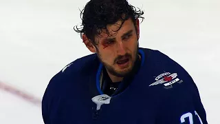Jets' Hellebuyck cut open after Morrissey's stick accidentally clips him