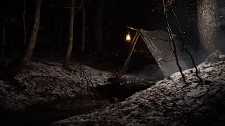 Survivor in the woods build a shelter over a creek . Heavy Snowstorm. Fire Pit Over the water. ASMR