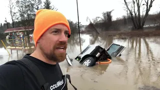 WOW! Truck sinks in flood waters after driving around safety barrier!