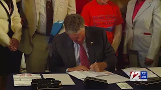 McKee signs bills banning guns on school grounds, straw purchases