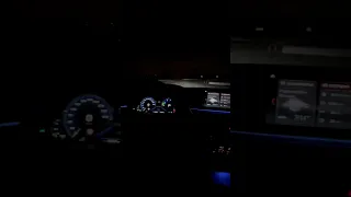 Bmw G30 interior at night, ambient light.