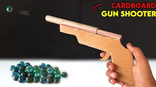 how to make cardboard gun powered by rubberband | Marble shooting gun | easy shooting toy