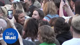 Thousands make heart-shaped signs at the Manchester memorial