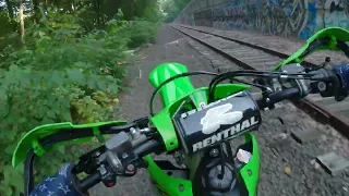 kx250x on train track and down hill enduro