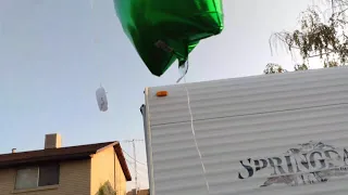 Letting balloons go up in the sky , with a scripture attached.