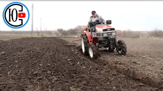 Old Japanese tractor 1989. PASH with a harrow.