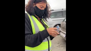 This Lady Car-guard Froze When She is Blessed with Free Grocery
