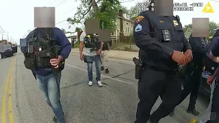 Body cam video shows Cleveland police searching for legal cause to arrest armed Black activist (2/3)