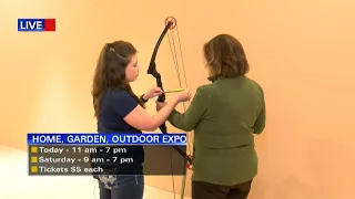 Chelsea Simmons and Tanya Carter show off their archery skills