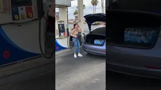 Girl  tries to fill up Tesla model 3 with gasoline