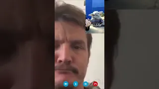 Pedro Pascal/Mando vibing with Baby Yoda during video call