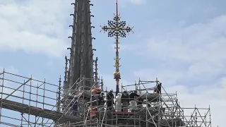 Cross installed at top of Notre Dame cathedral in Paris