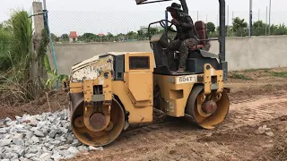 Powerful Road Construction Dump Trucks Unloading Rocks, Bulldozer Pushing, Roller At Work!