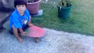 Jai on his Dads old SkateBoard....