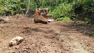 Caterpillar Bulldozer D6R XL Powerfully Pushes Large Boulders