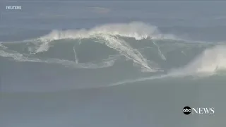 Surfers ride huge waves in Nazare