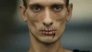 Pussy Riot protest: Russian artist sews his mouth together in support