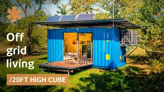 Off-grid container home uses pulleys to lower/raise bed & deck