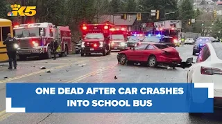 Passenger in sedan dead after crash involving school bus in Renton, driver arrested