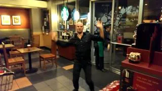 Guy dancing at Starbucks.