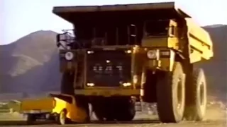 CAT Haul Truck flattens pickup truck!