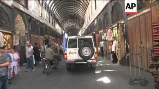 UN observers tour blast sites at Hamadiyeh market and Justice Palace