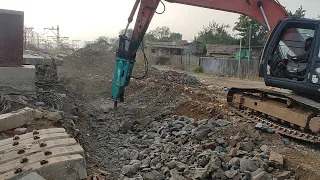 Civil Engineering :- Breaking Rock with Poclain Machinery