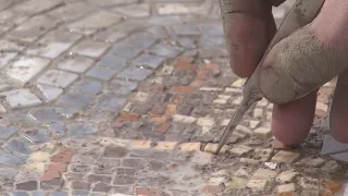 Beautifying Chicago's street craters: Local artist turning potholes into works of art