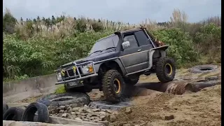 Nissan Safari driving the 4wd Obstacle Course in the wet, at Auckland Off Road Adventure Woodhill NZ