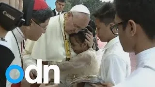 Pope hugs weeping girl at Philippines Sermon: 'He reminds me of my father'