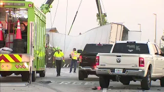 Crash on Florida Turnpike leaves semi-truck dangling off overpass