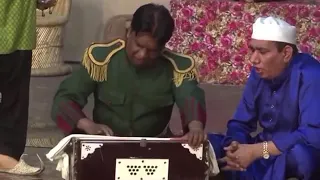 Amanat Chan playing  Harmonium in Stage Show