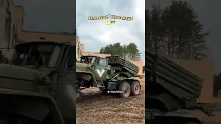 Ukrainian ZIL-131 heavy truck towing a Russian BM-21 Grad 122mm multiple rocket launcher system