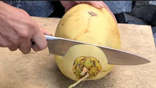 Amazing skill in peeling yellow coconut