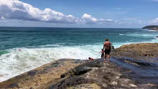 Surfers brave dangerous waves and get swept off rocks