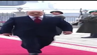 Wide Lukashenko walking but he's not all the time in frame
