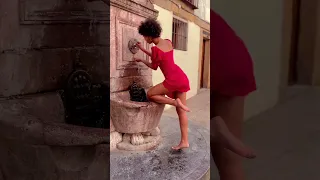 Sexy African girl in red dress #shorts #girl #dress #redlover #fountain #barefoot #african #beauty