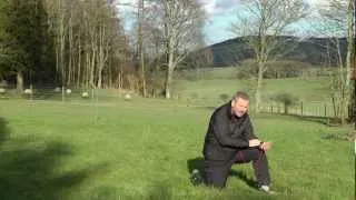 Taking a compass bearing from a landscape feature