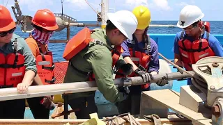 Cutting a sediment core, Marine Geology & Geophysics Field Course 2019