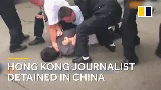 Hong Kong journalist handcuffed and dragged into police van in China