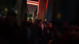 Grown men fight over for an autograph at a red carpet premiere in downtown Los Angeles