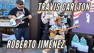 Travis Carlton with Street Musician Robert Jimenez in front of Norman's Rare Guitars